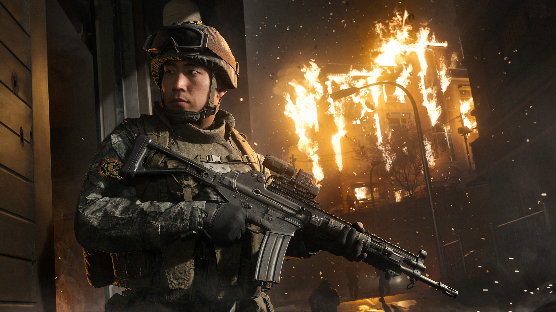 Modern Warfare 4 soldier holding a rifle in a burning street at night